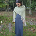 Bosque Claro lightweight wool ruana in soft green and cream tones