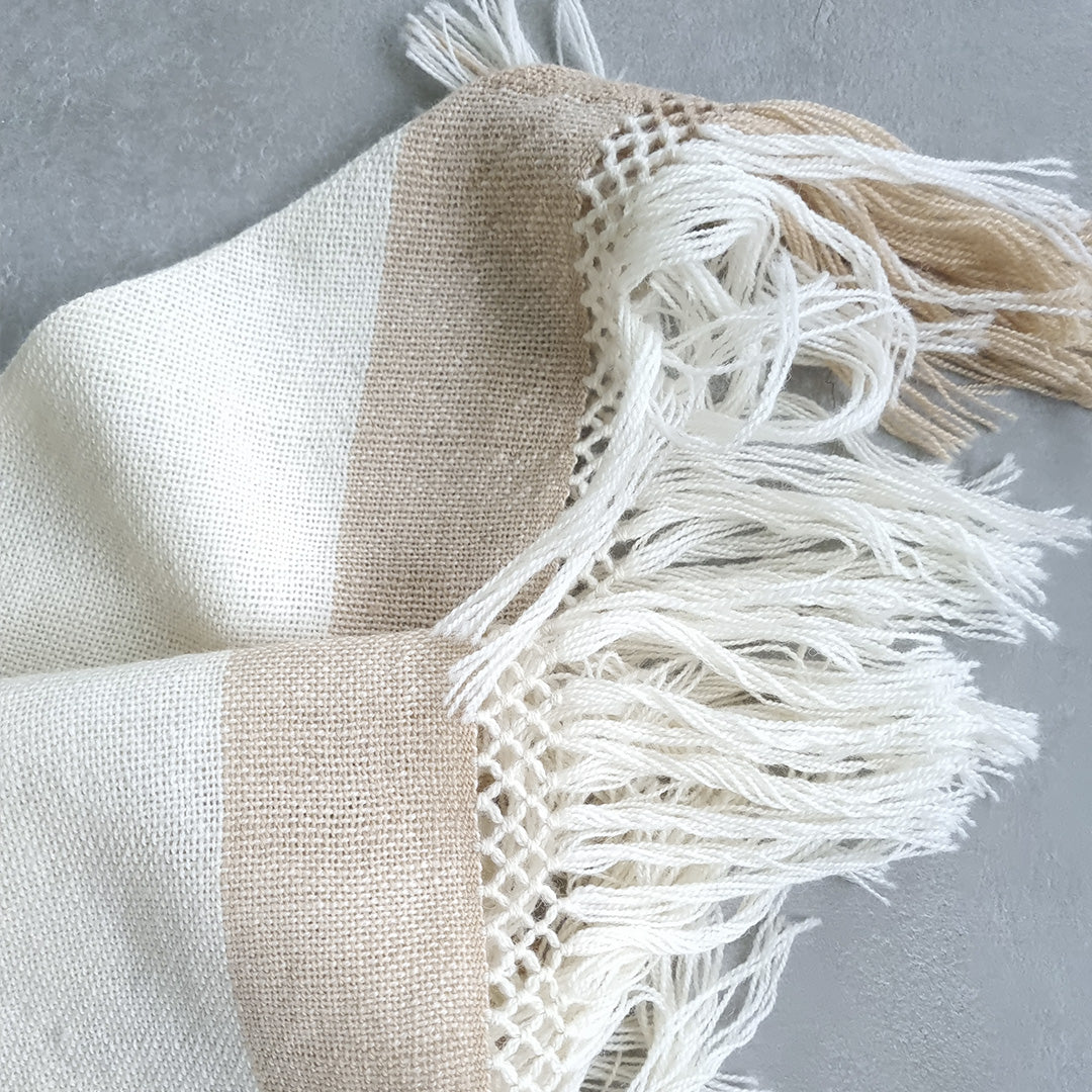 Lightweight wool ruana with soft cream base selected by Vakiano