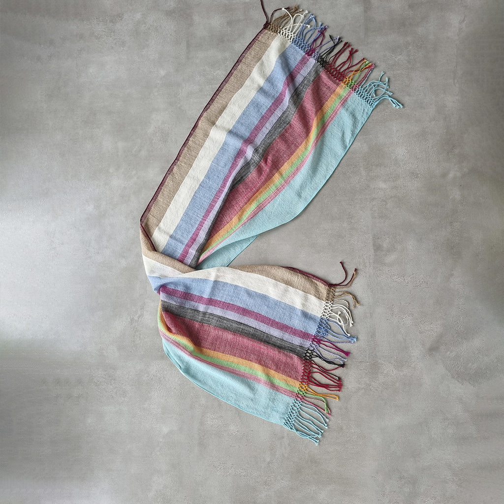 Lightweight wool shawl in blue red yellow green and neutral stripes