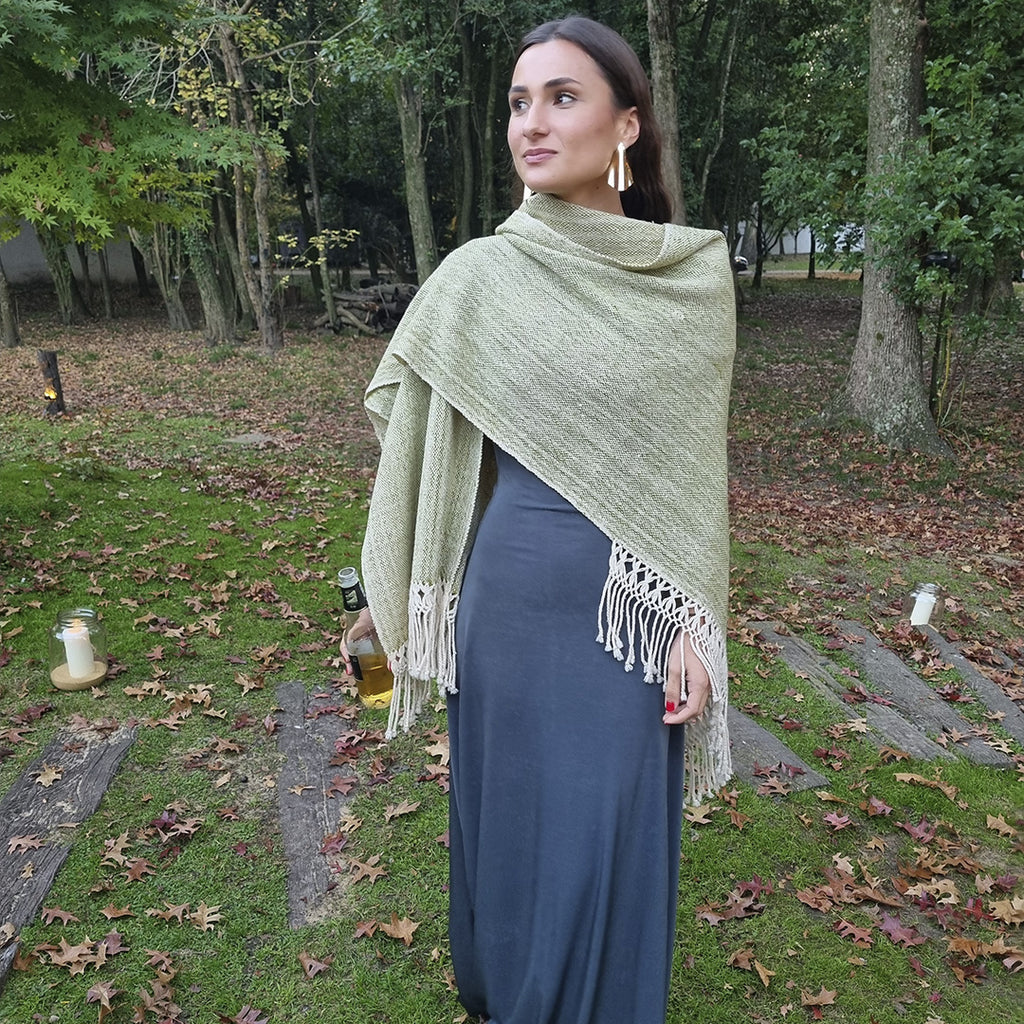 Soft green wool wrap worn outdoors over the shoulders