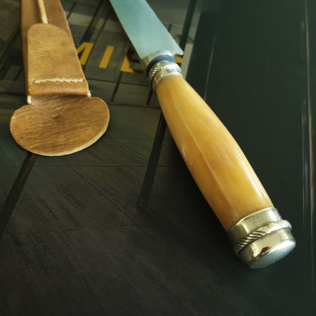 Yellow potro bone knife with alpaca details
